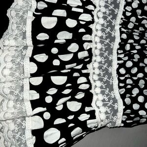 Tiered polka dot gown.